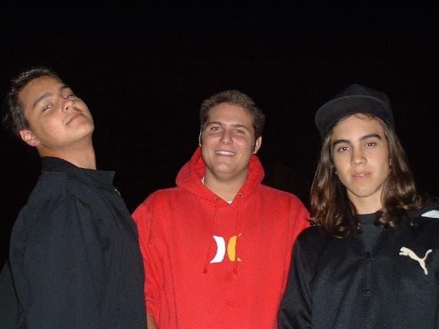 Justin as a teenager with two friends at night