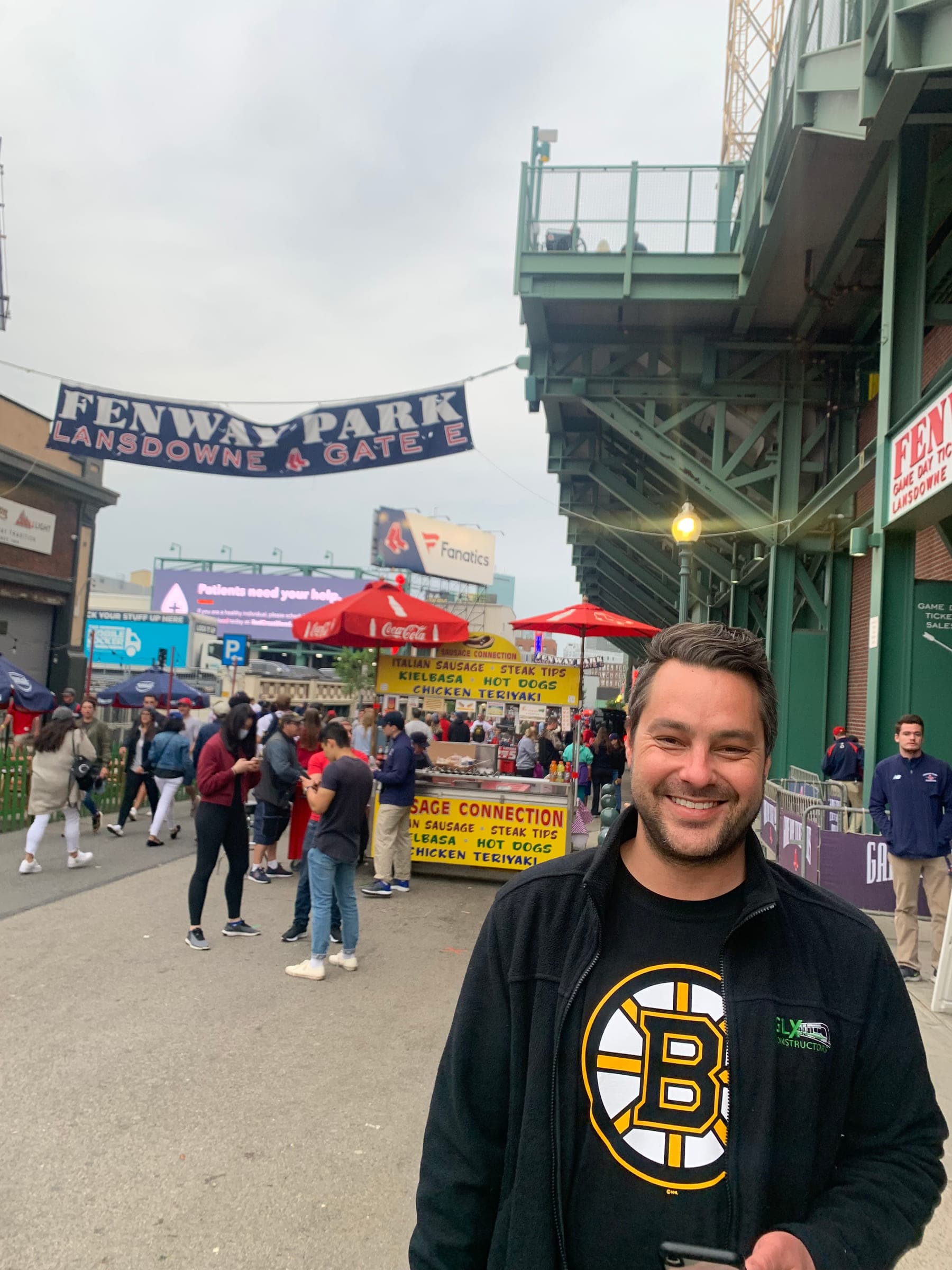 Justin outside Fenway Park in a Boston Bruins shirt